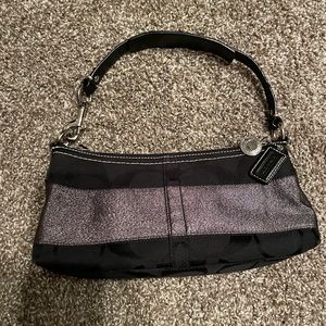 Black coach bag with silver sparkles in middle